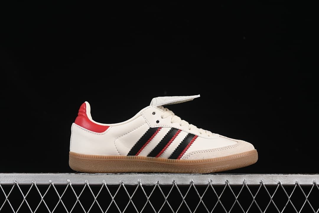 Side profile of the off-white sneaker with black and red stripes and gum outsole.