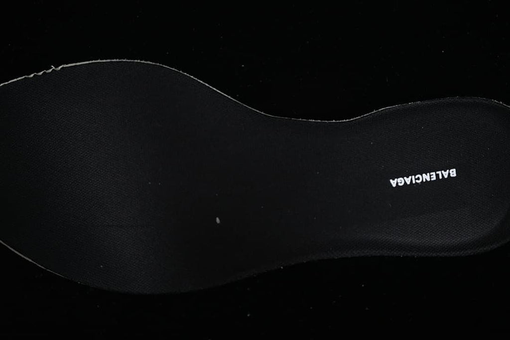 Black insole with visible brand lettering