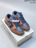 Brown and dark navy low-top sneakers displayed on a box