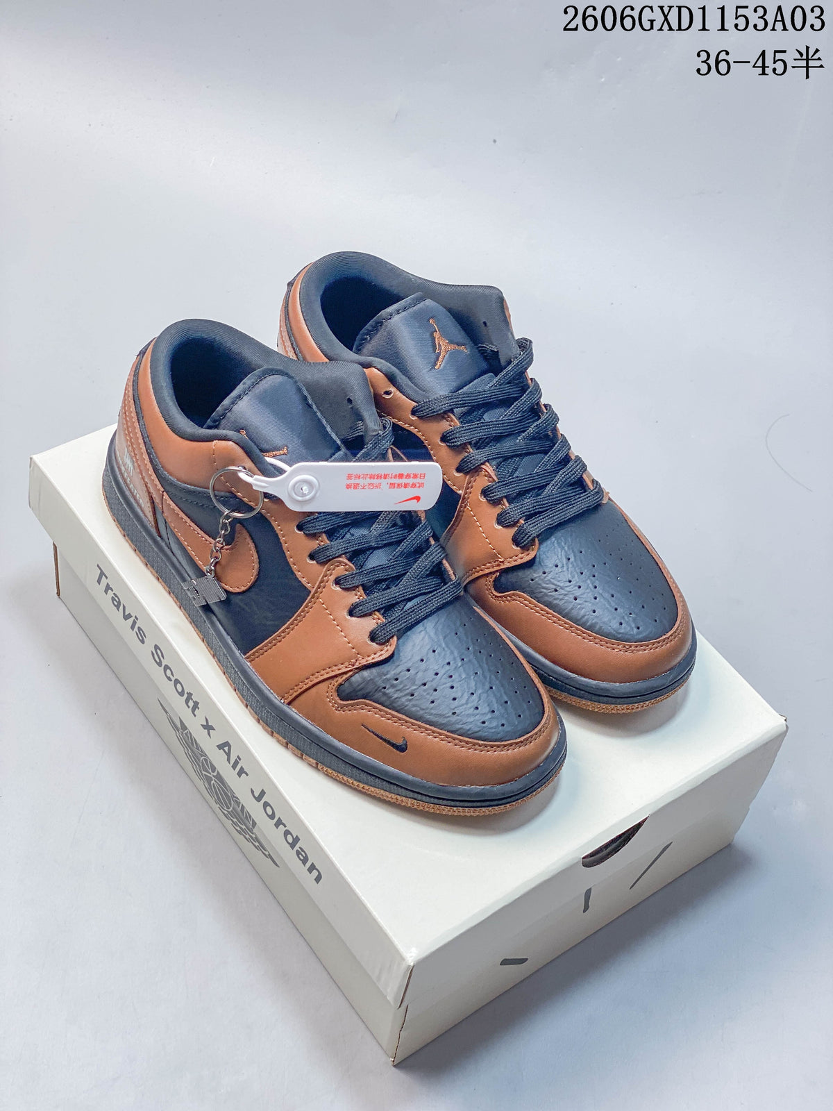 Brown and dark navy low-top sneakers displayed on a box