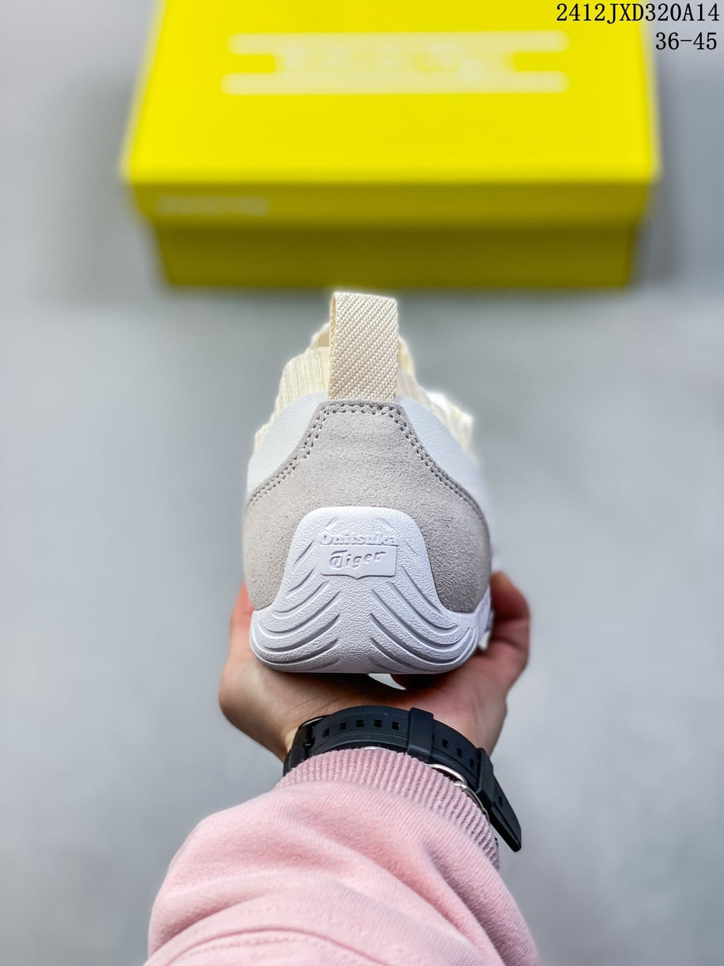 Rear view of the sneaker with a gray heel overlay and pull tab