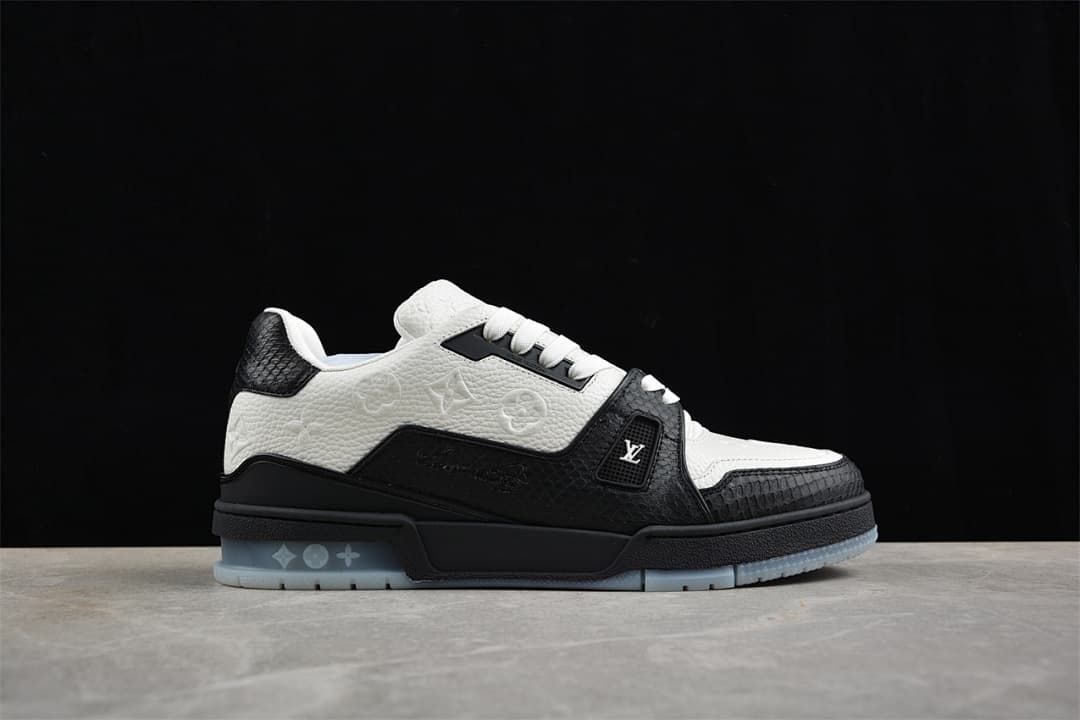 Side view highlighting the embossed upper, black overlays, and translucent outsole.