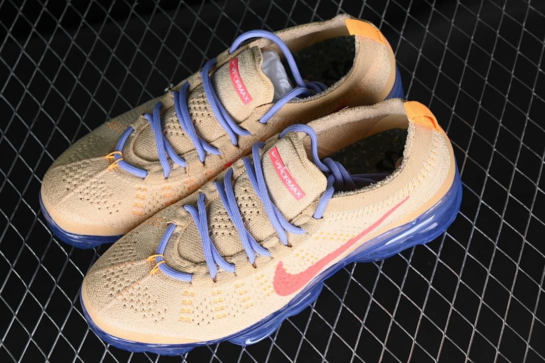 Pair of beige Nike Air VaporMax 2023 Flyknit sneakers viewed from above.