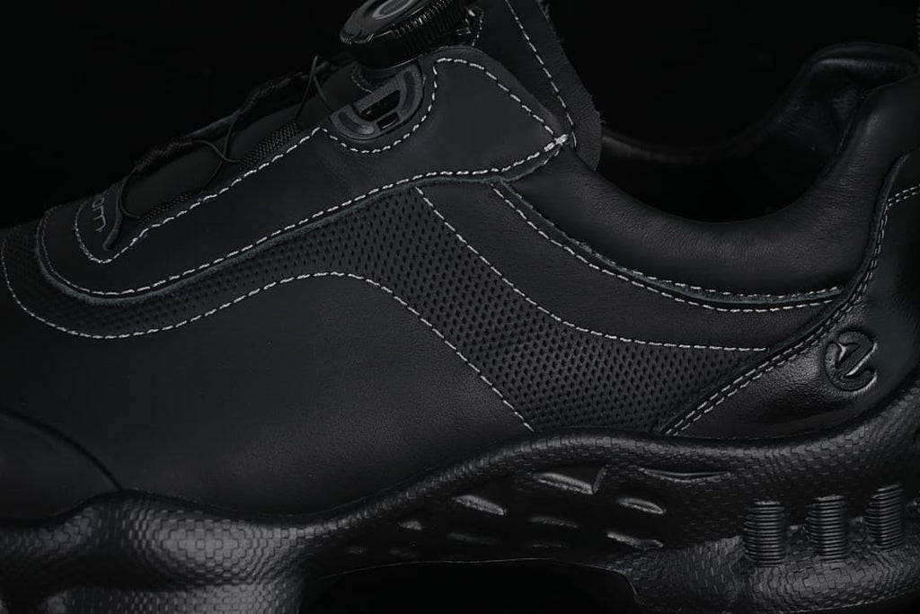 Close-up of the sneaker's perforated side panel and contrast stitching