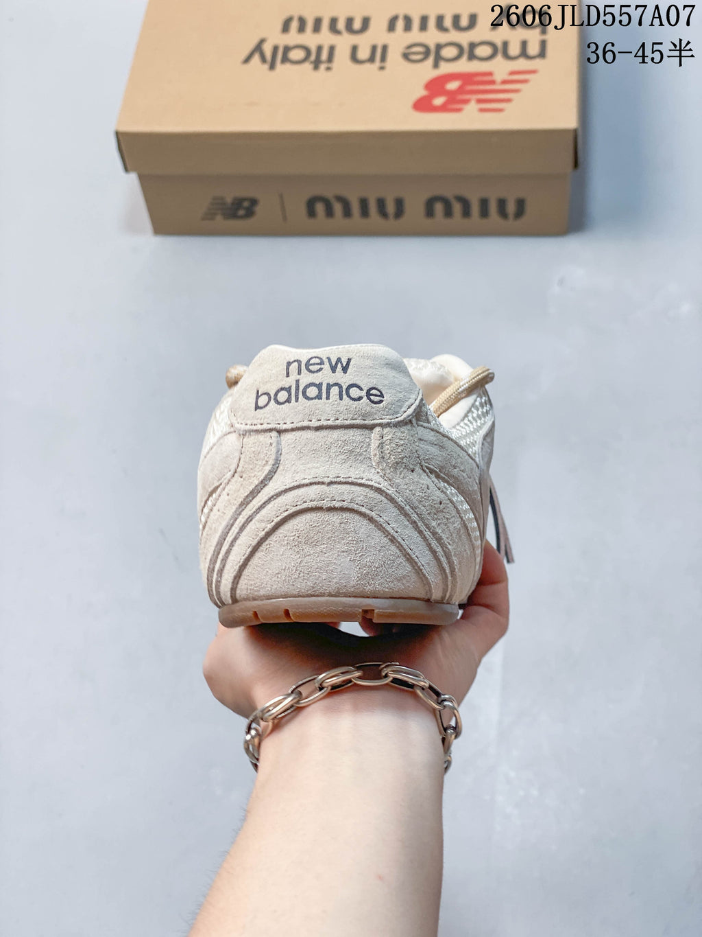Rear view showing the heel and New Balance branding on the sneaker.