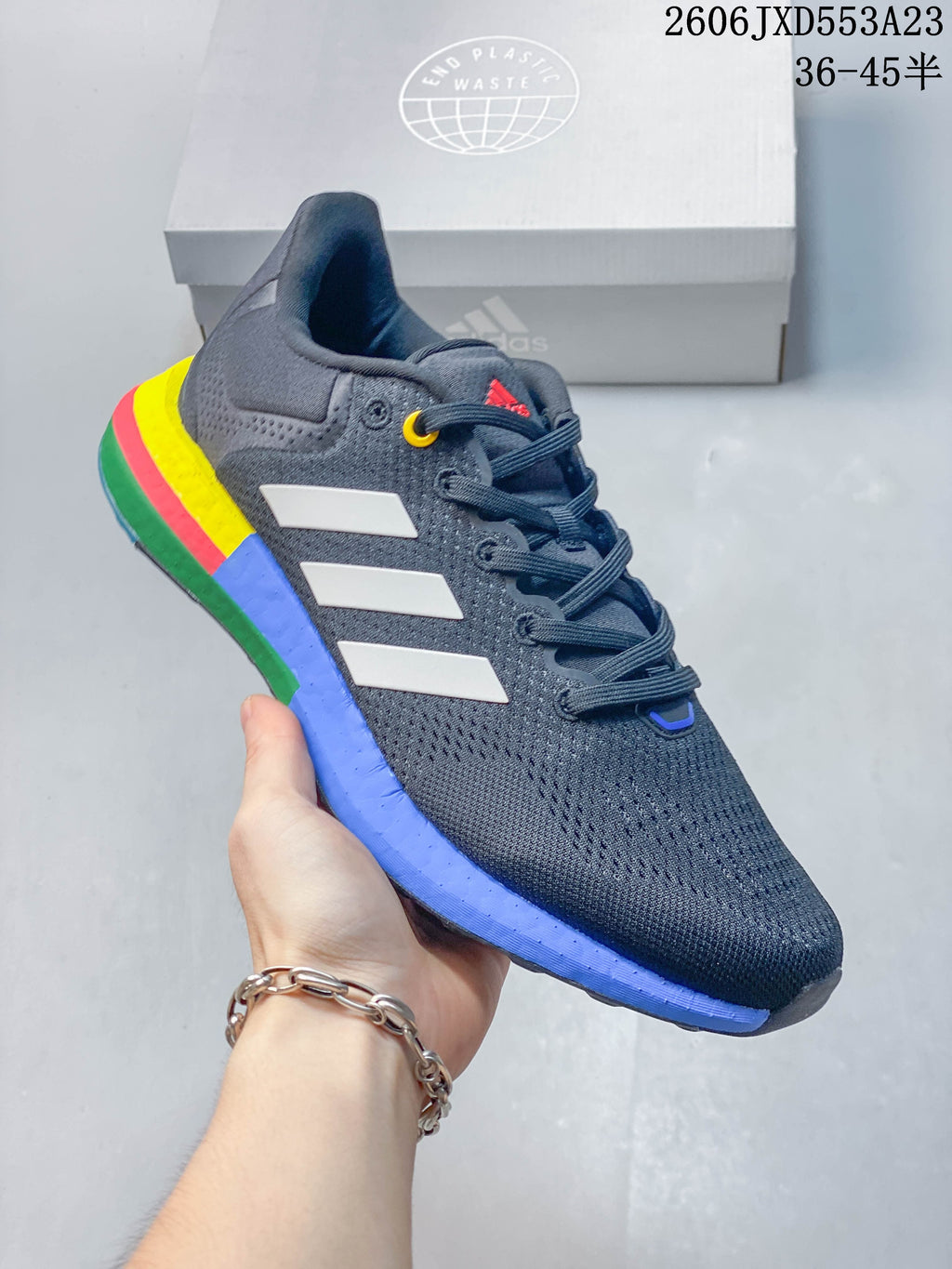 Angled side view of the charcoal Adidas PureBoost 21 shoe