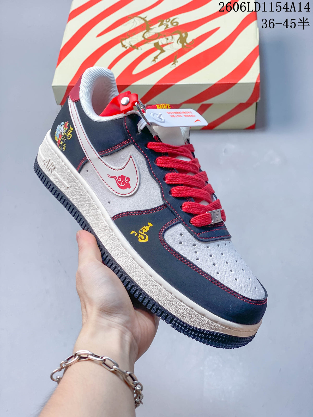 Angled side view showing embroidered accents and the navy, white and red colorway