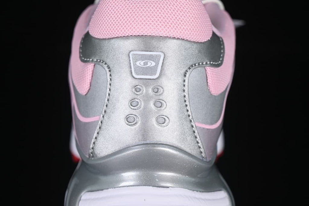 Rear view of the sneaker showing silver-tone heel panels and pink collar