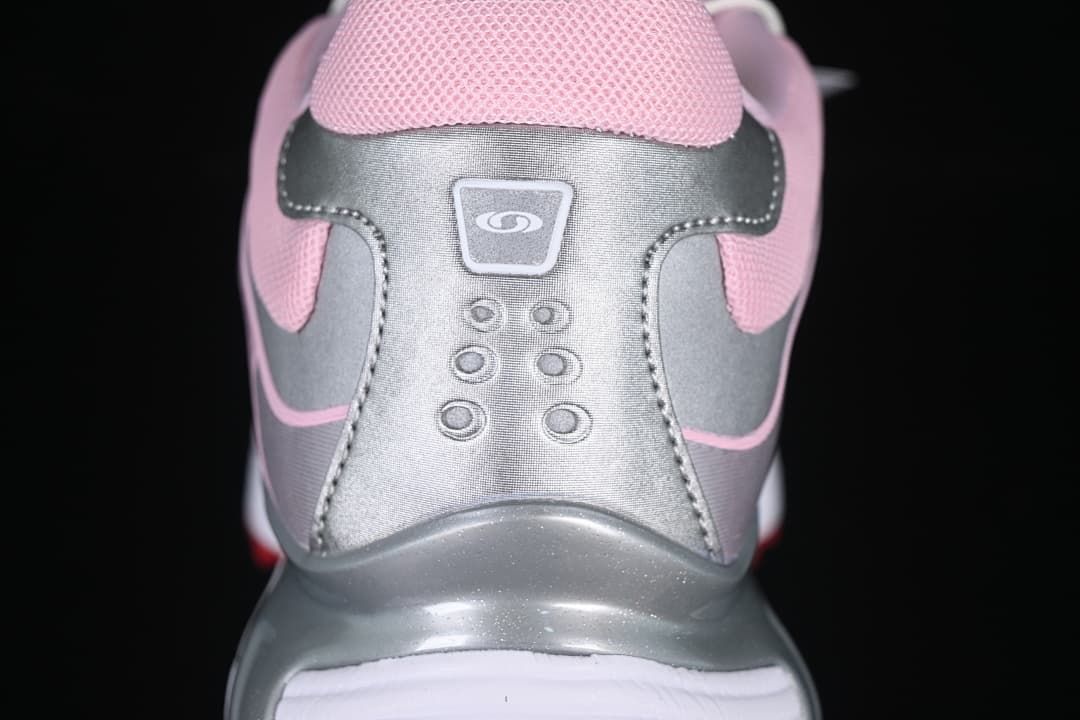Rear view of the sneaker showing silver-tone heel panels and pink collar