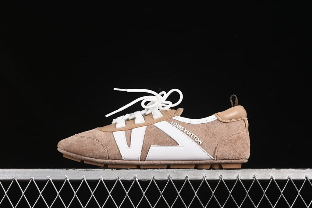 Side view of beige and white Louis Vuitton Sneakerina lace-up sneakers