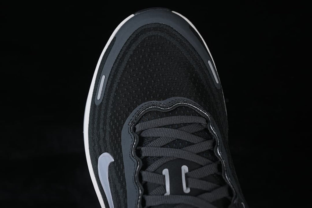 Top-down close-up of the shoe's toe and lacing.