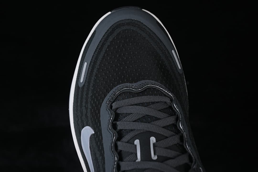 Top-down close-up of the shoe's toe and lacing.