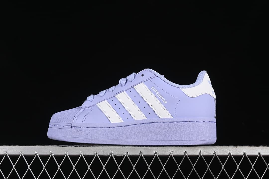 Side view of the lavender Superstar XLG sneaker with white stripes