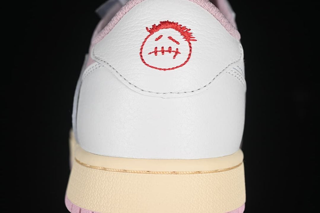 Rear view showing white heel panels and red embroidered graphics