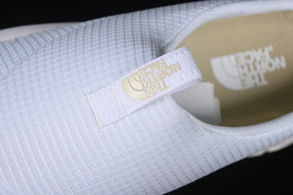 Close-up of the upper pull tab and footbed branding