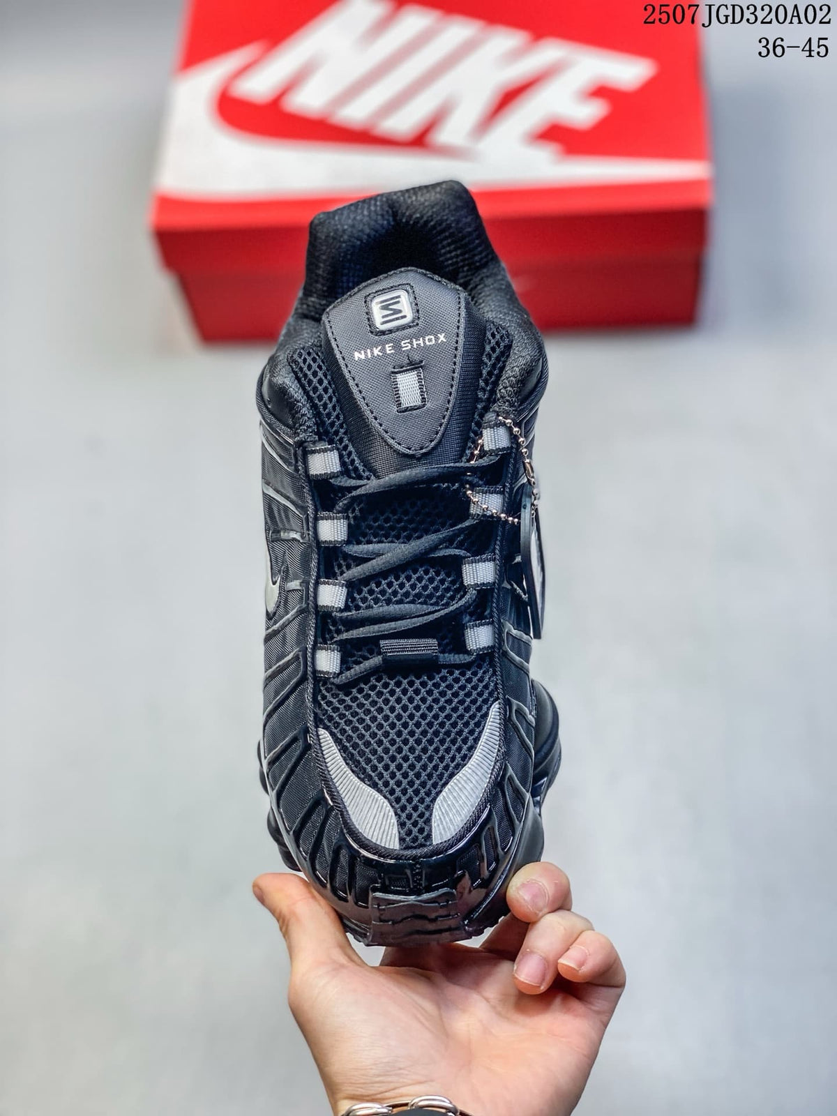 Front view showing the mesh-look upper, laces, and Nike Shox tongue label