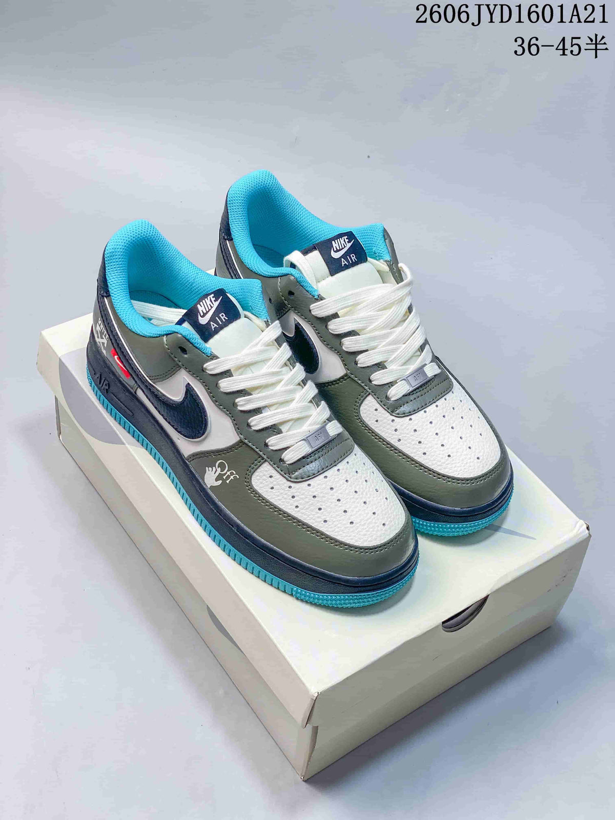 Pair of white, muted green, navy, and bright blue low-top sneakers shown from above.