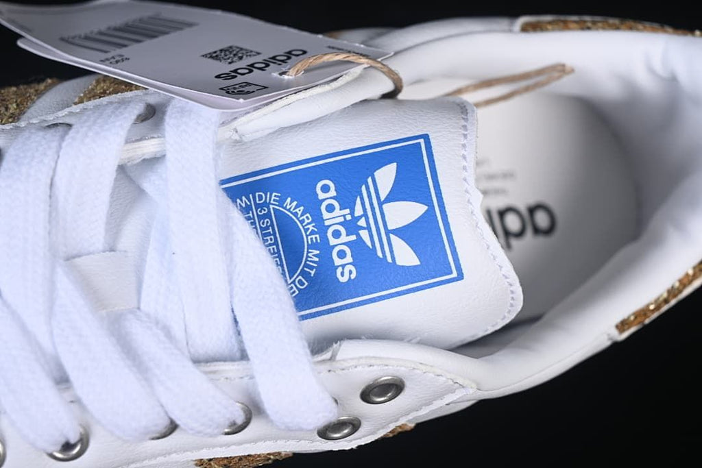 Close-up of the white laces and adidas tongue label