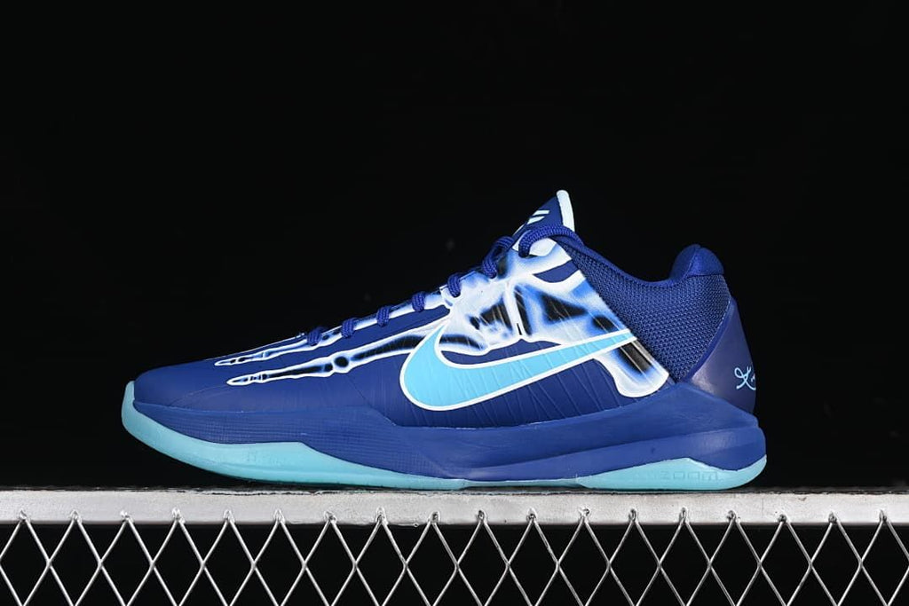 Side view of blue Nike Kobe 5 Protro basketball shoe with aqua Swoosh and outsole
