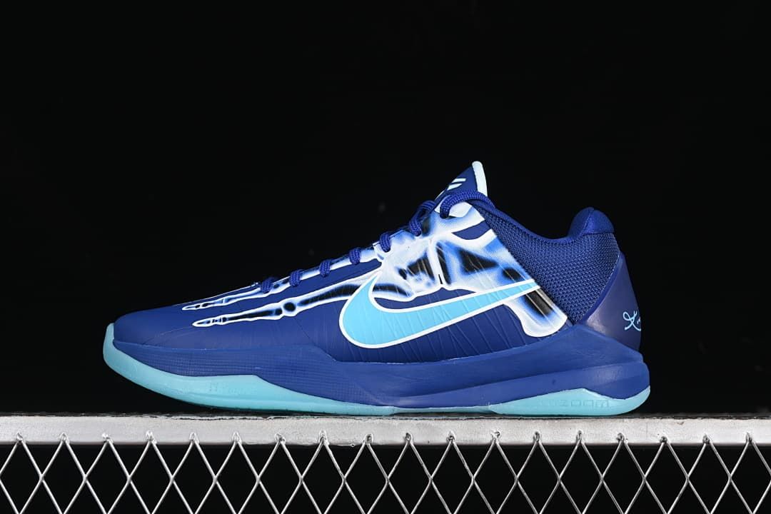 Side view of blue Nike Kobe 5 Protro basketball shoe with aqua Swoosh and outsole
