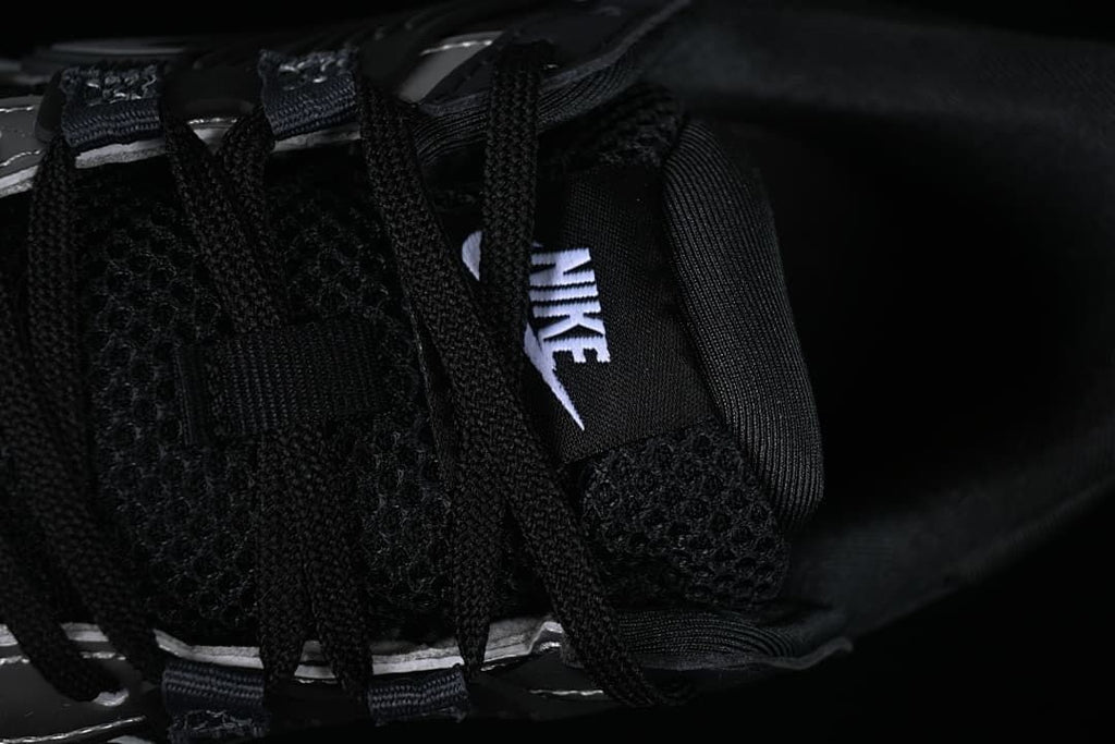 Close-up of the black laces and tongue branding