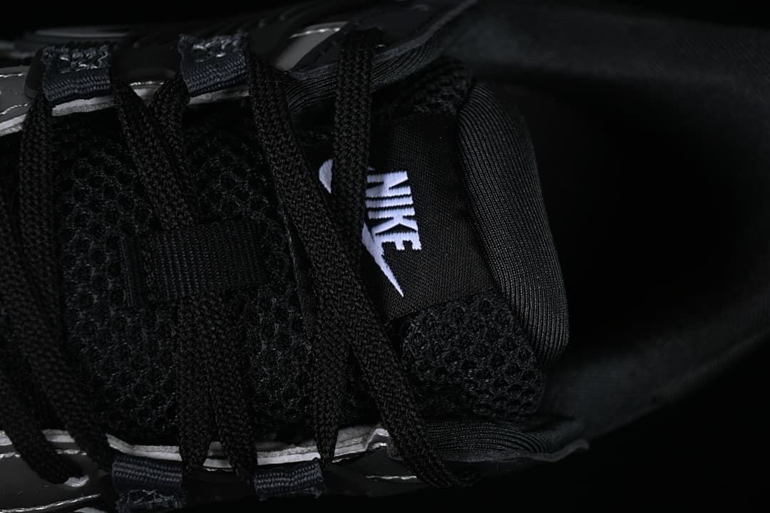 Close-up of the black laces and tongue branding