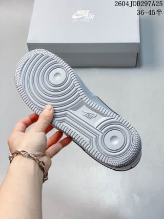 Underside view showing the concentric-circle tread pattern and textured rubber outsole of the sneaker.