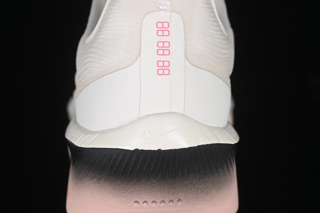 Rear view of the shoe heel with pink and black details