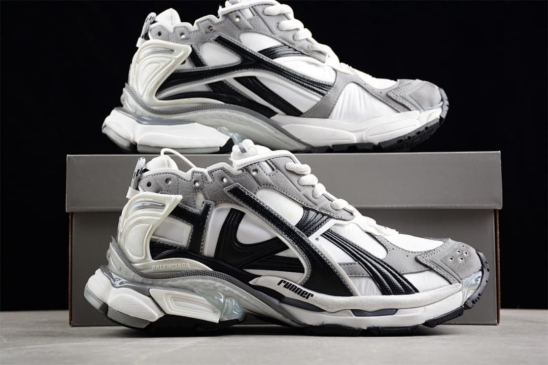 Two side views of the Runner sneakers displayed with a shoe box