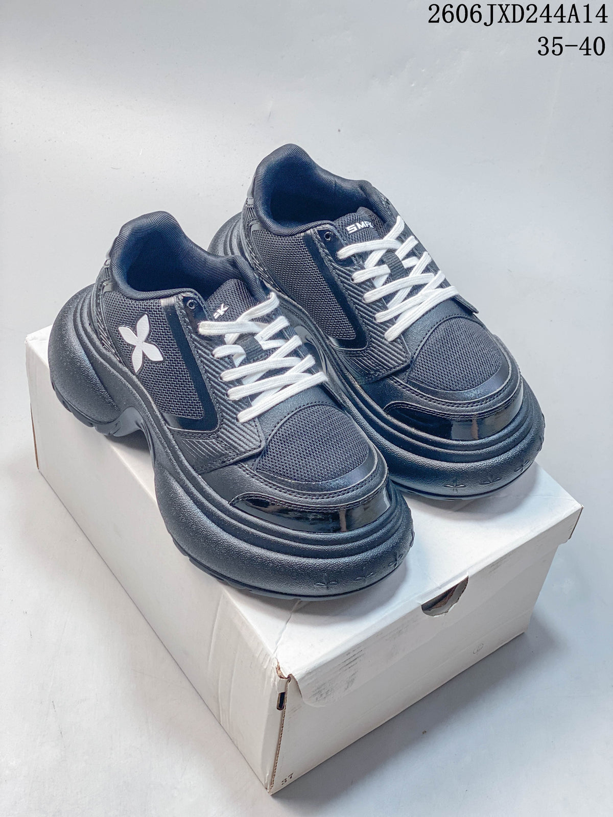 Pair of dark navy SMFK sneakers shown from the front