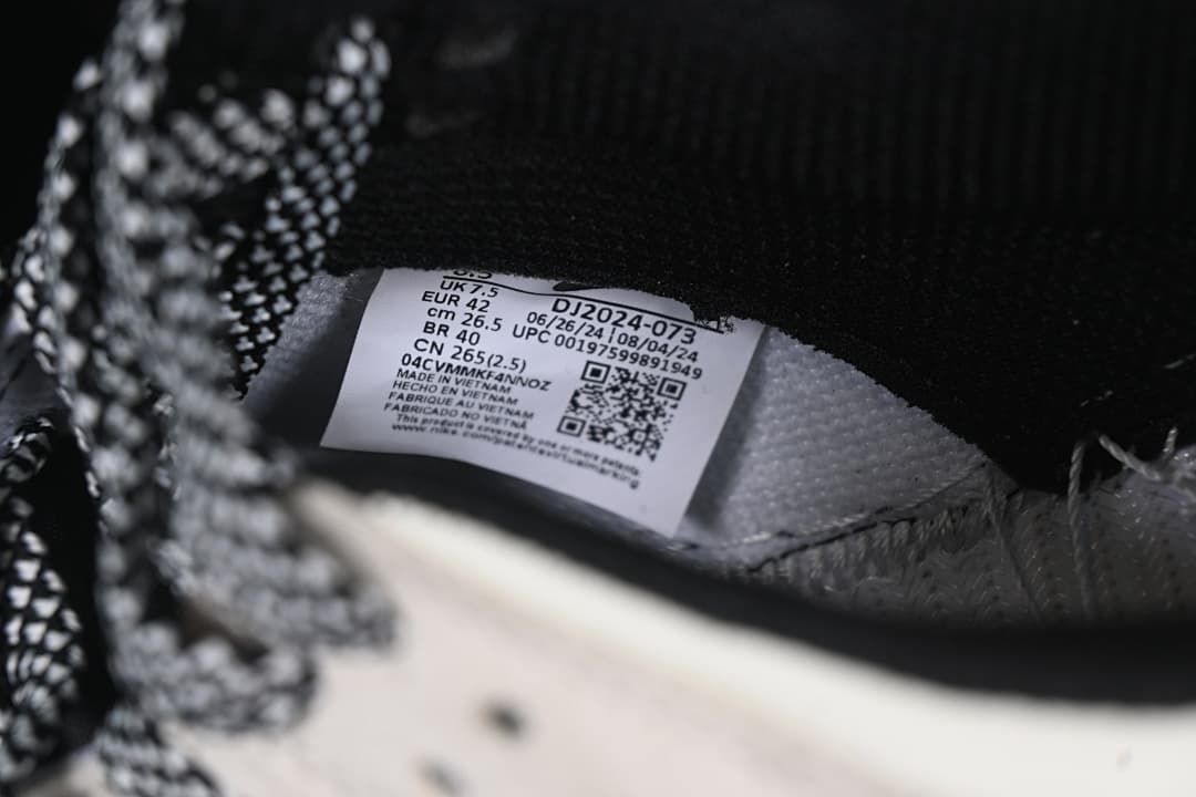 Inside shoe label showing size EU 42 and style code DJ2024-073