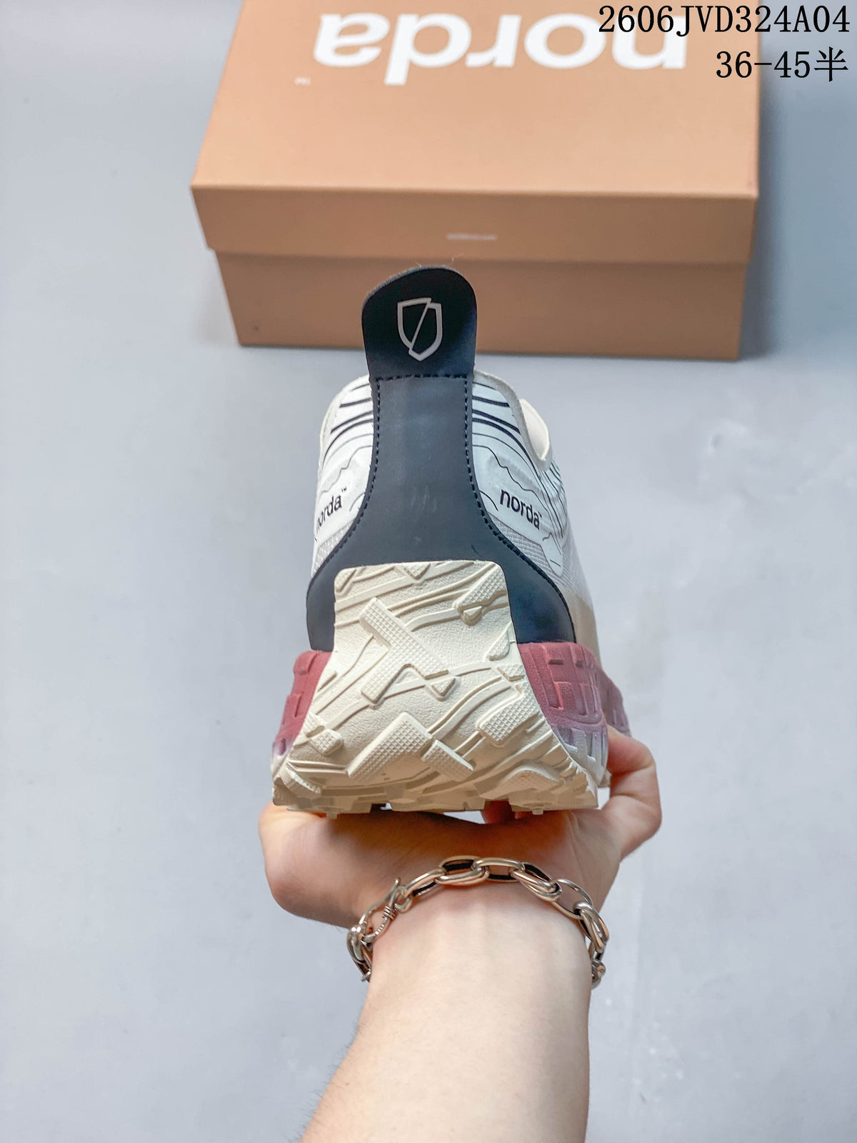 Rear view of a Norda sneaker with a dark heel detail and lugged sole.