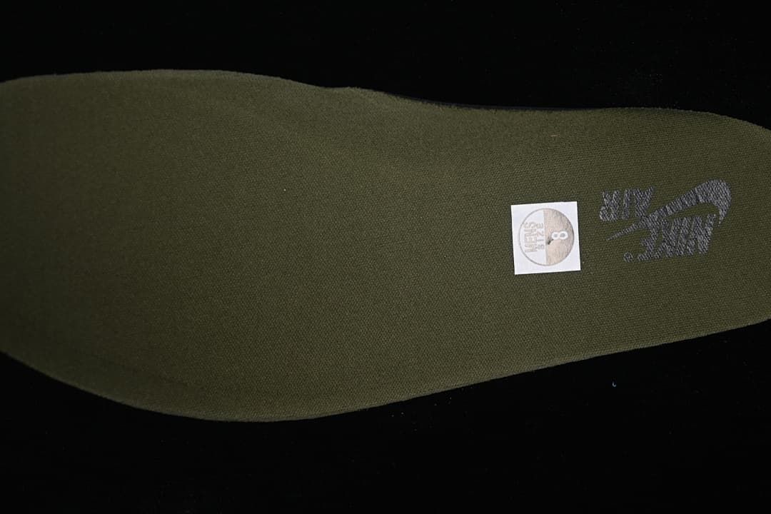 Close-up of the olive insole with branding