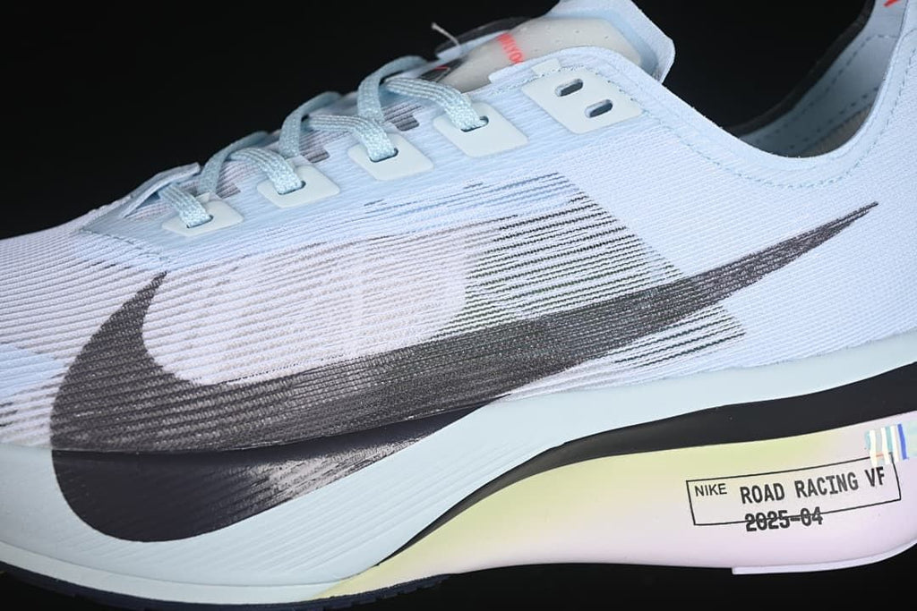 Close-up of the dark Swoosh and lace eyelets
