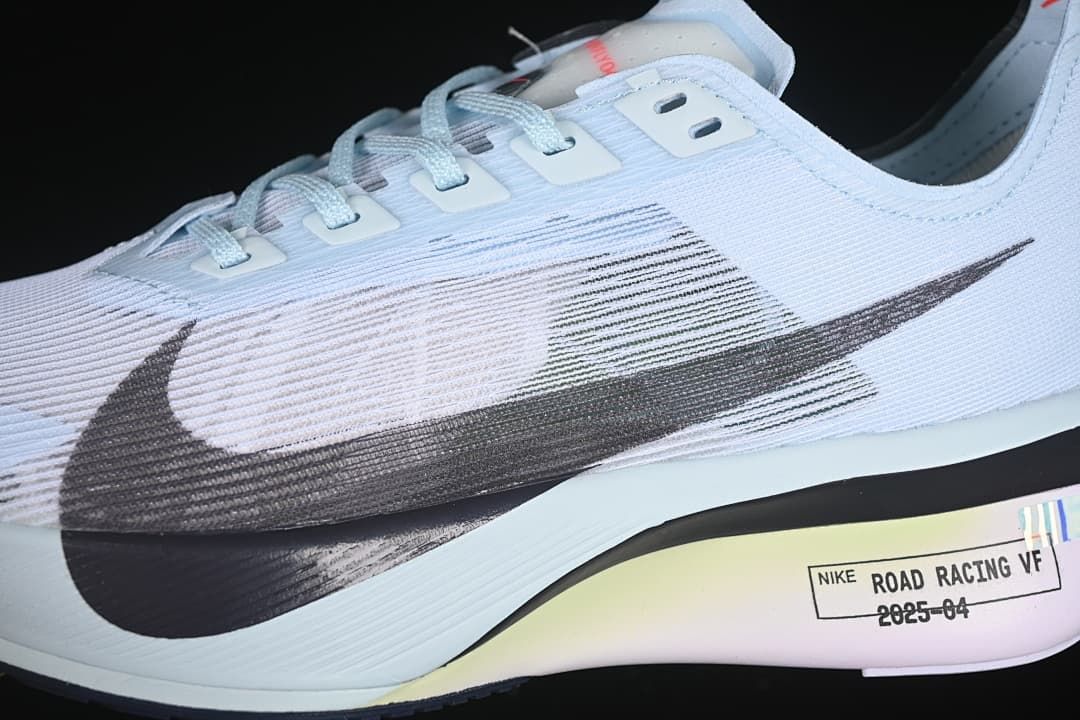 Close-up of the dark Swoosh and lace eyelets