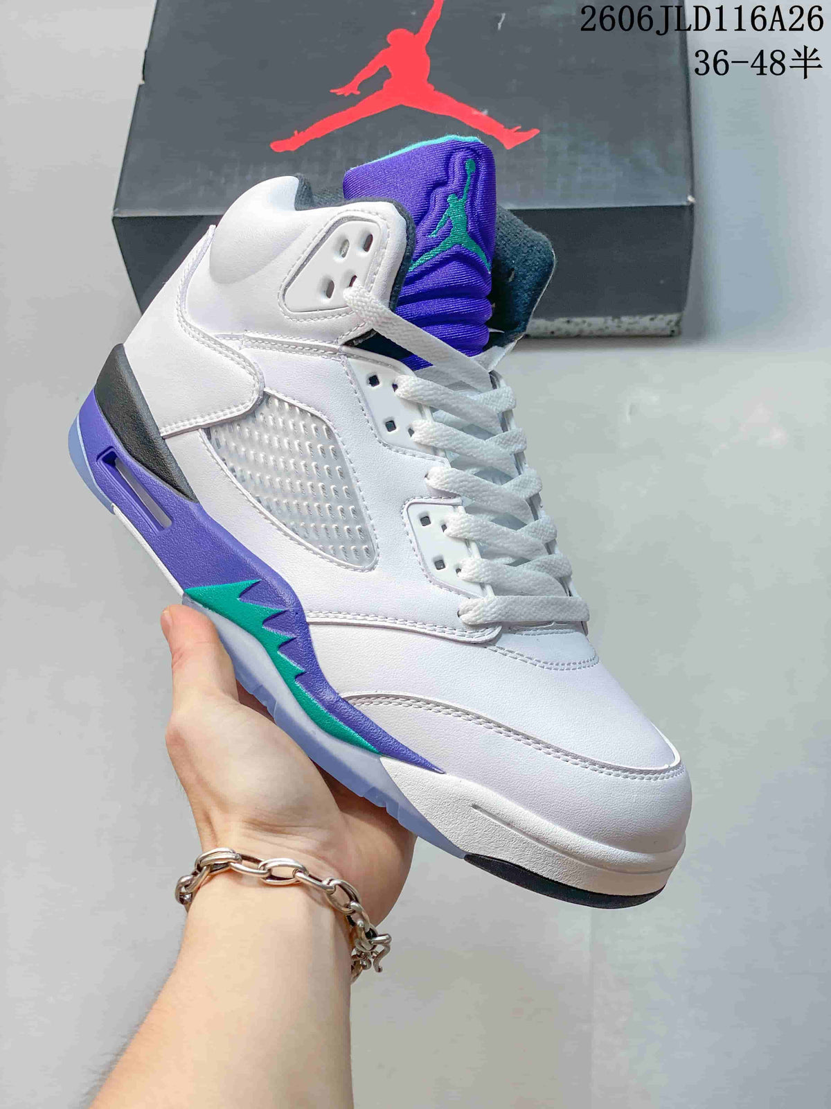 Side view of a white high-top sneaker with purple and teal accents