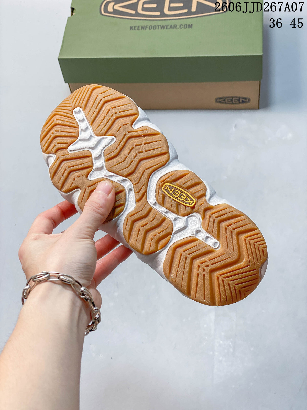 Close-up of the sandal outsole showing a patterned gum-colored tread
