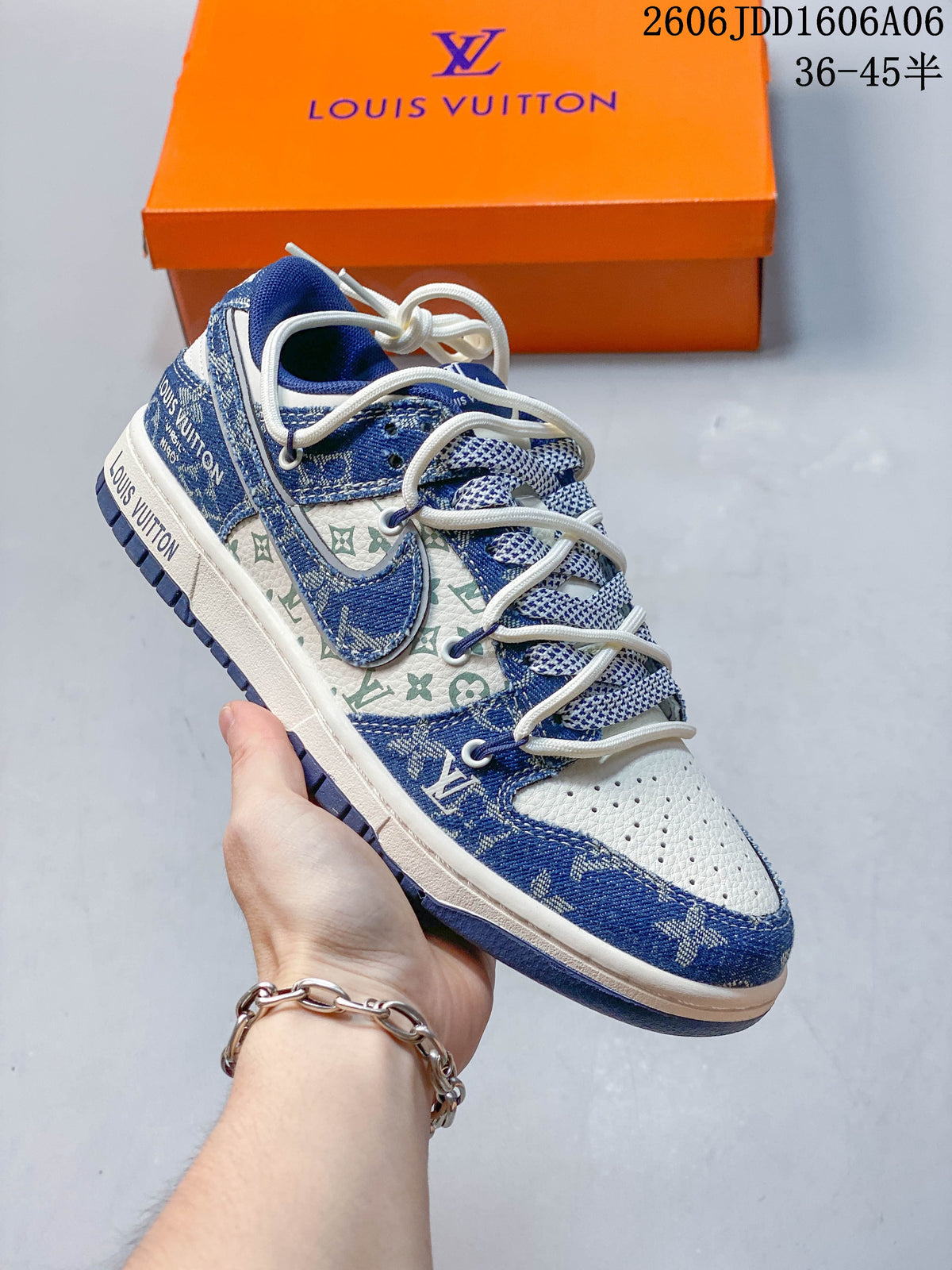 Angled side view of the blue and cream patterned sneaker with contrasting Swoosh