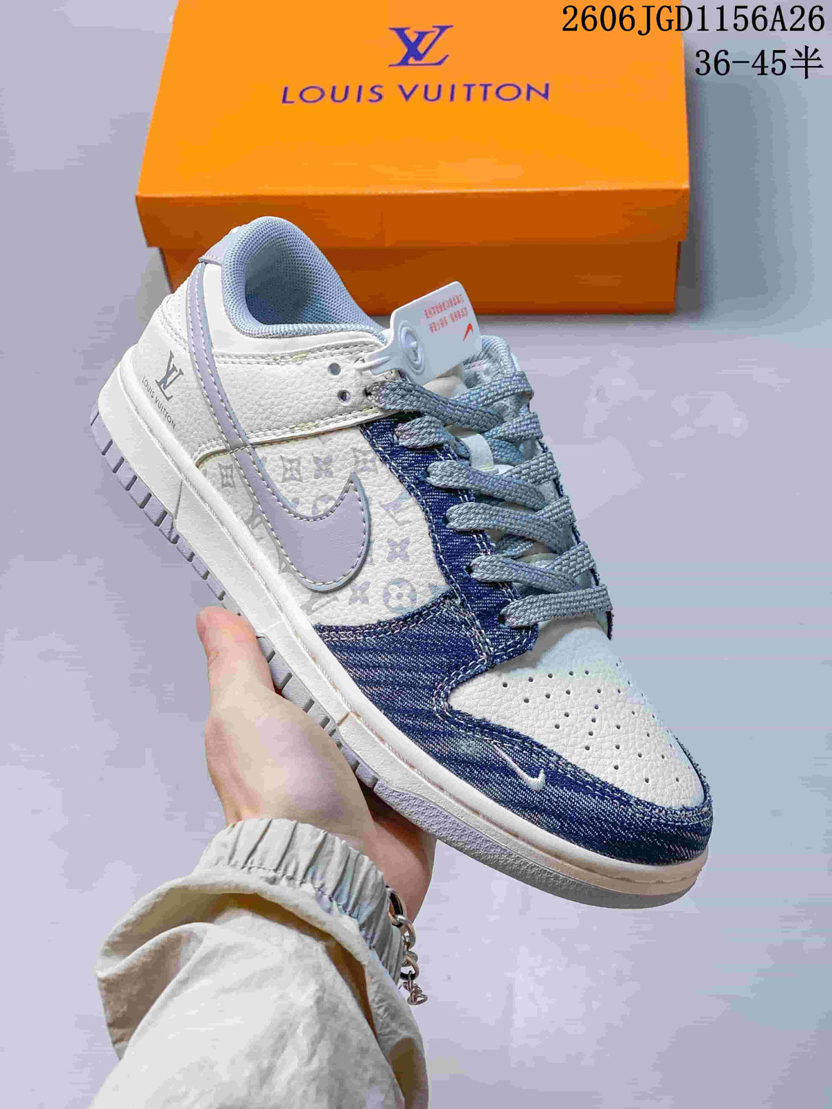 Close-up of a white low-top sneaker with gray and blue patterned panels and gray laces