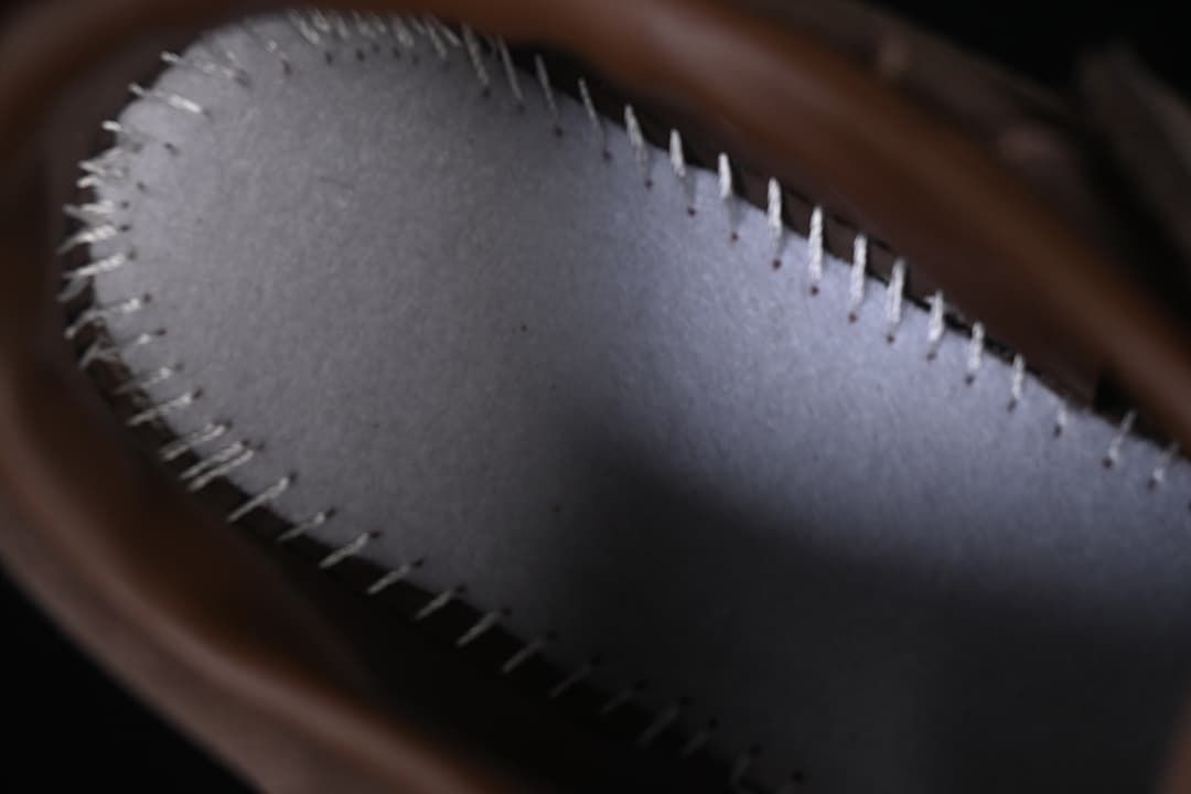 Close-up of the sneaker's stitched interior lining.