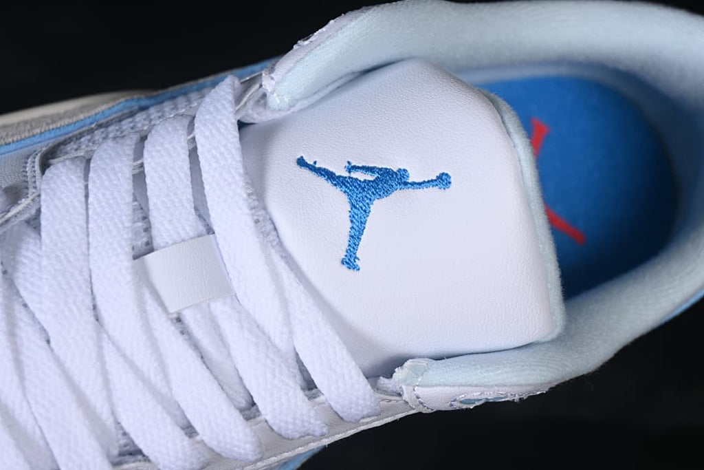 Close-up of the tongue logo, laces, and blue insole