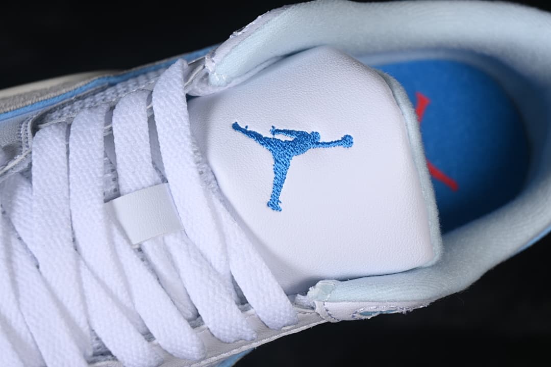 Close-up of the tongue logo, laces, and blue insole