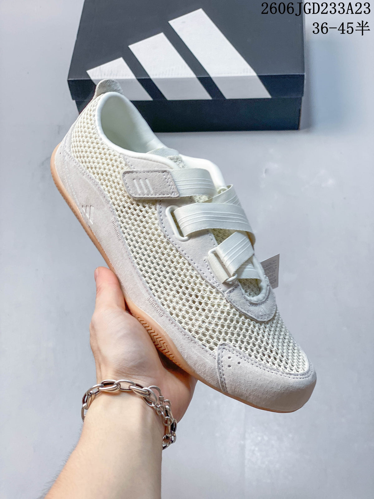 Angled side view of an off-white adidas Urban Reverie low-top sneaker