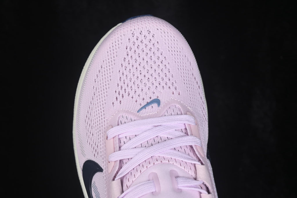 Close-up of the pale pink mesh toe box, laces, and Nike Swoosh detail.