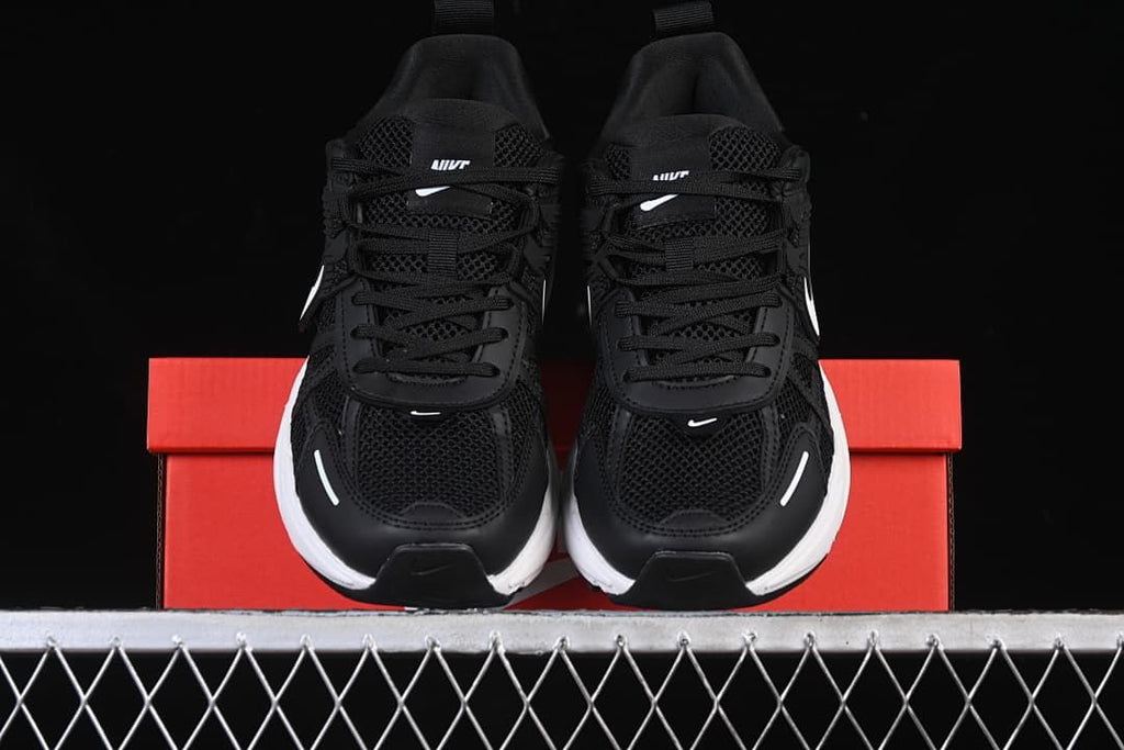 Front view of the pair resting on a red shoe box.