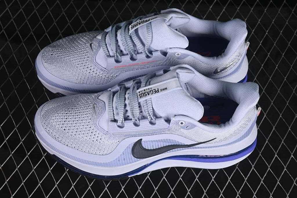 Pair of gray and lavender running shoes shown from above and the side