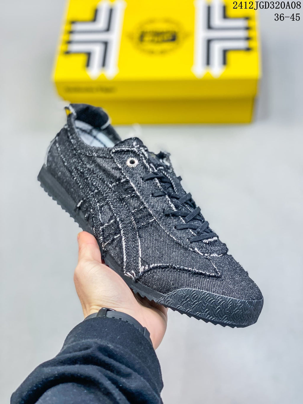 Angled side view of the dark low-top sneaker and textured outsole