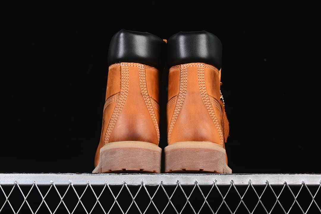 Rear view of the pair showing padded collars and stitched heel panels