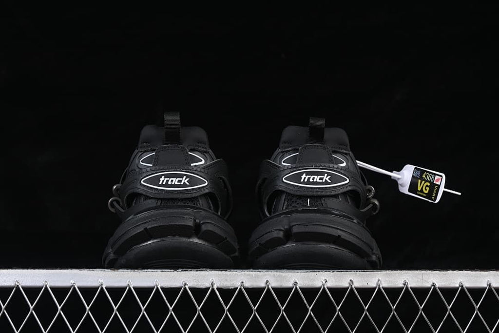 Rear view showing the Track logo straps and chunky soles