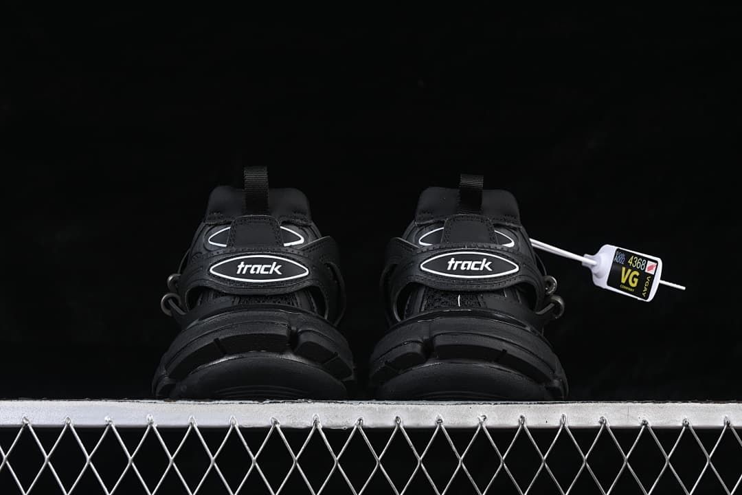 Rear view showing the Track logo straps and chunky soles